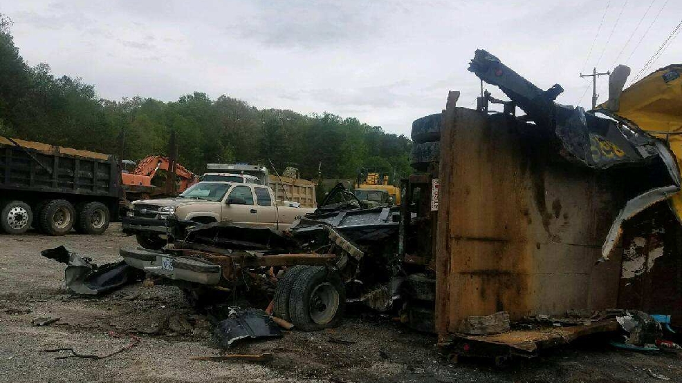 Henderson County dump trucks toppled and trashed WLOS