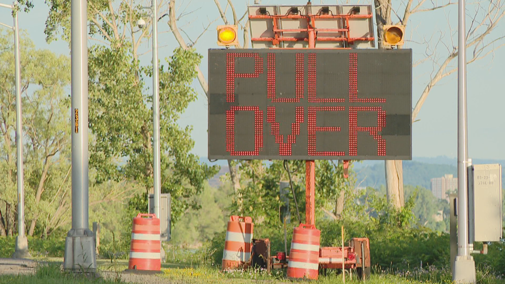 Onondaga Lake Parkway signs warn to "Pull Over" and "Stop Now" if vehicle is too tall WSTM