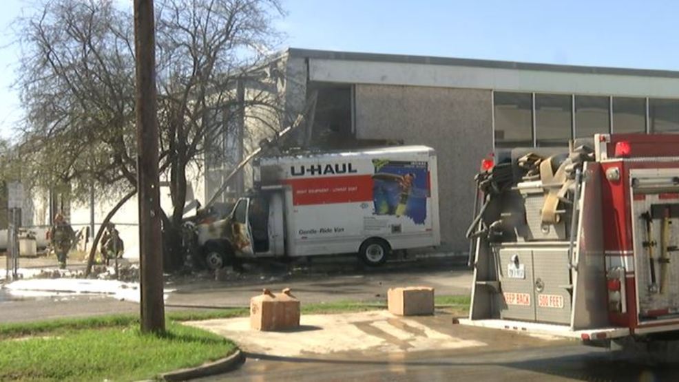 U Haul Truck Catches Fire After Crashing Into Building And Tree