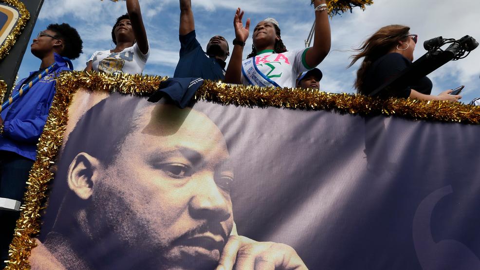 APTOPIX MLK Day Miami Martin Luther King Jr. march and banner ATLANTA.jpg